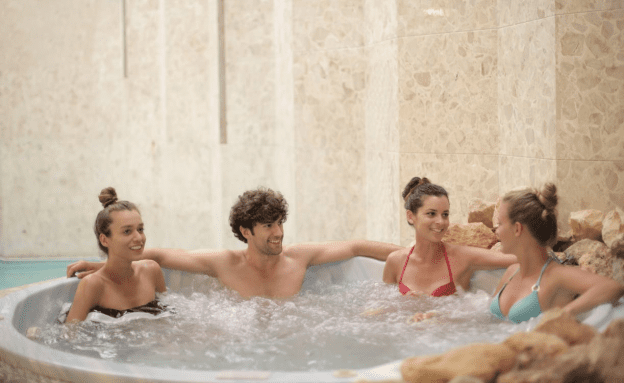 A group of people in a hot tub 