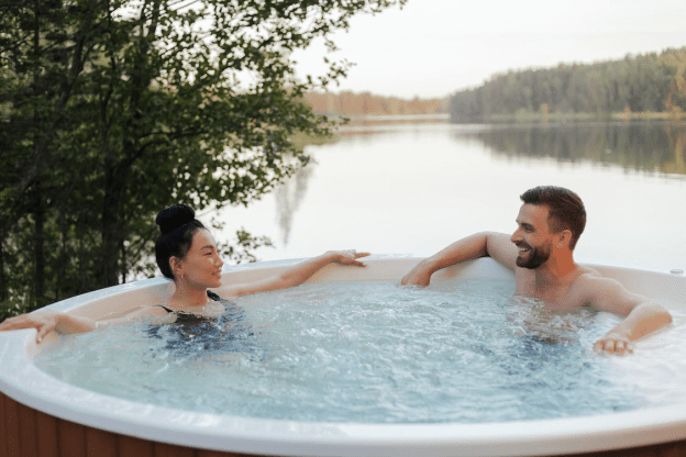 Two people relaxing in an outdoor hot tub